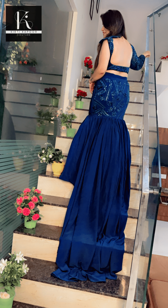 Blue Heavy Choli and fish - cut skirt with attached trail - Kirti Kapoor Couture