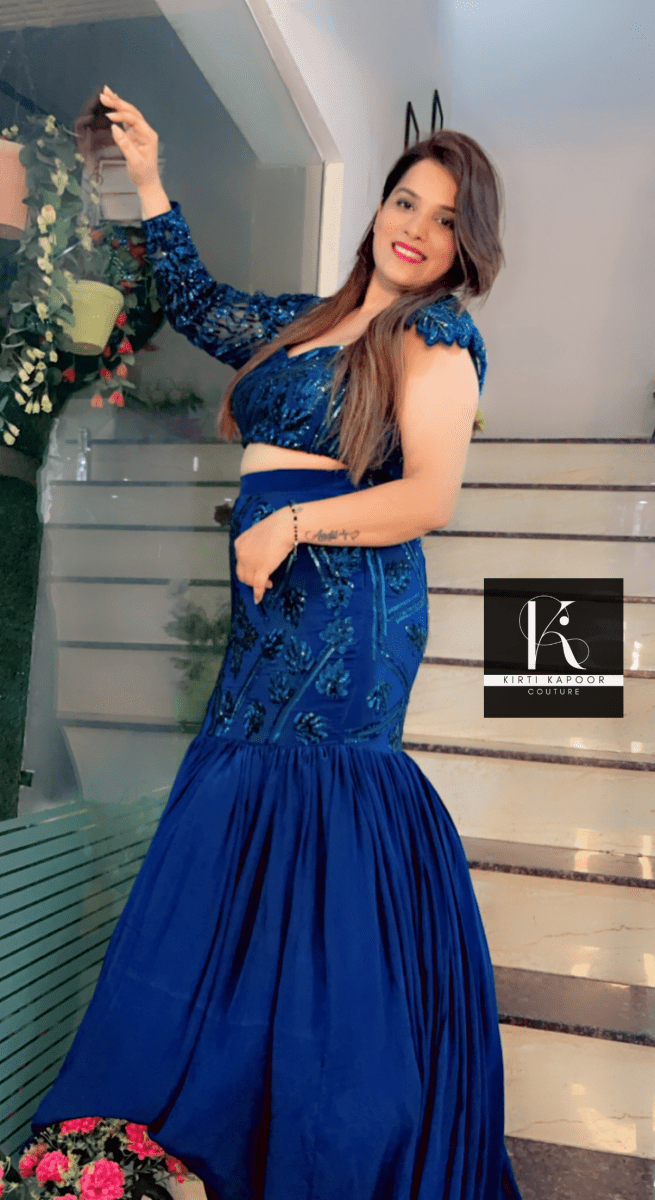 Blue Heavy Choli and fish - cut skirt with attached trail - Kirti Kapoor Couture