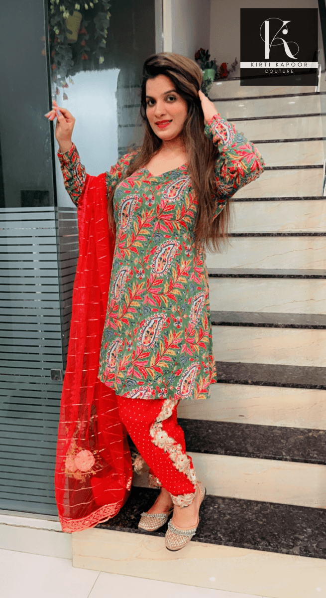 Green Peplum Dhoti Suit With Red Dupatta - Kirti Kapoor Couture