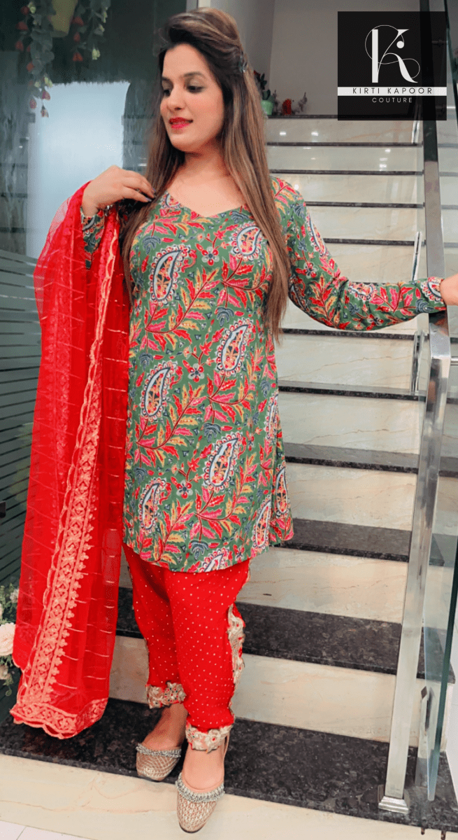 Green Peplum Dhoti Suit With Red Dupatta - Kirti Kapoor Couture