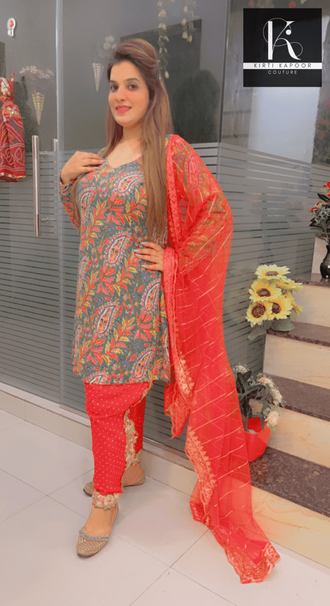 Green Peplum Dhoti Suit With Red Dupatta - Kirti Kapoor Couture