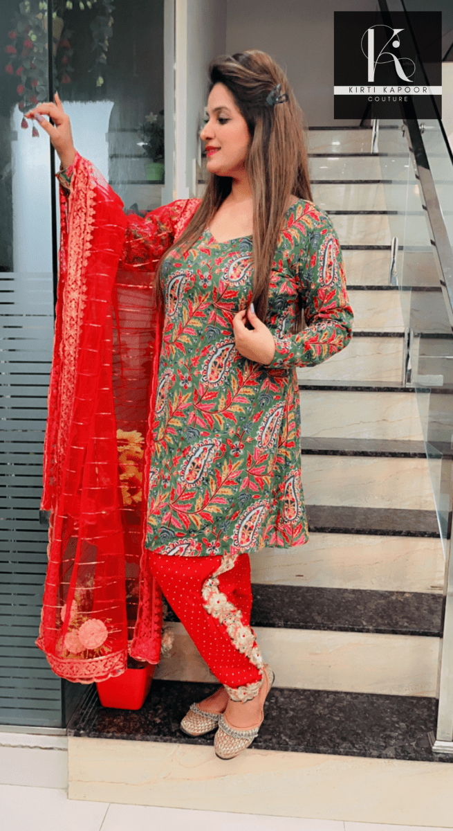 Green Peplum Dhoti Suit With Red Dupatta - Kirti Kapoor Couture