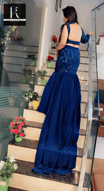 Blue Heavy Choli and fish - cut skirt with attached trail - Kirti Kapoor Couture