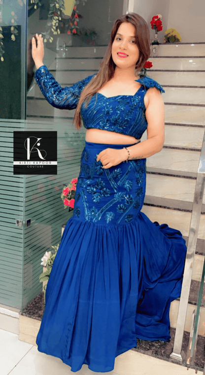 Blue Heavy Choli and fish - cut skirt with attached trail - Kirti Kapoor Couture