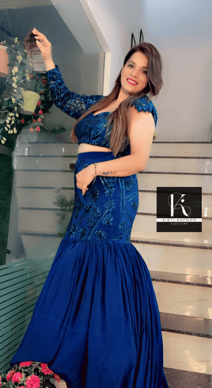 Blue Heavy Choli and fish - cut skirt with attached trail - Kirti Kapoor Couture