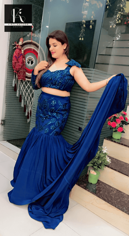 Blue Heavy Choli and fish - cut skirt with attached trail - Kirti Kapoor Couture