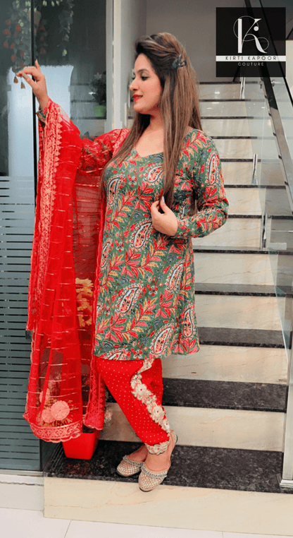 Green Peplum Dhoti Suit With Red Dupatta - Kirti Kapoor Couture